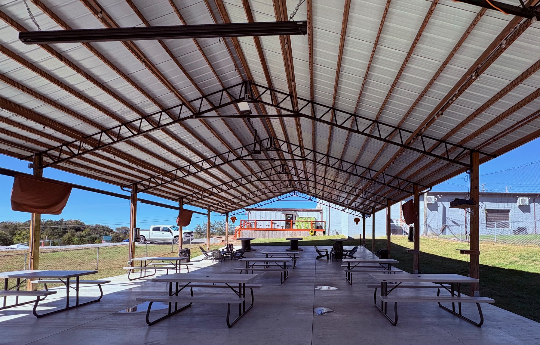 Covered Rocky's pavilion with picnic tables and seating